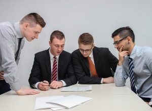 people_looking_at_document