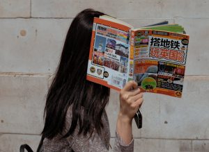 hiding_behind_book
